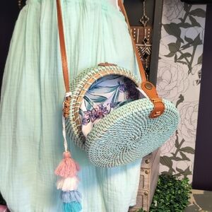 Aqua Woven Round Crossbody Bag with Floral Interior & Tassel Accent